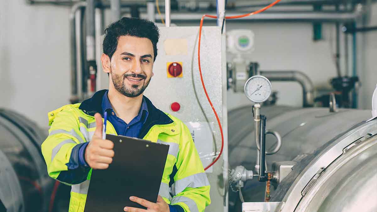 Operator who is happy with the benefits of IoT in industry